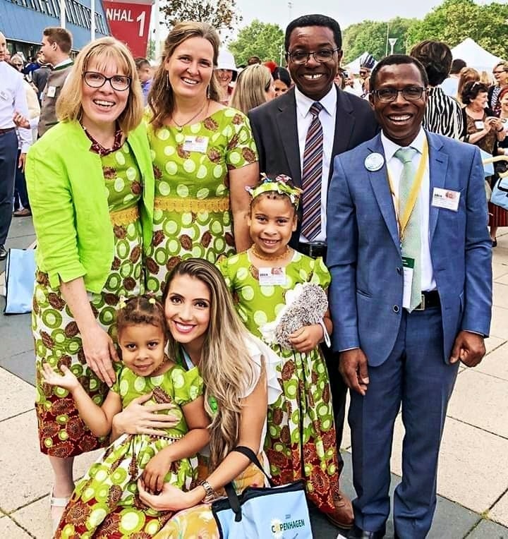 People smiling together at a congregation activity.